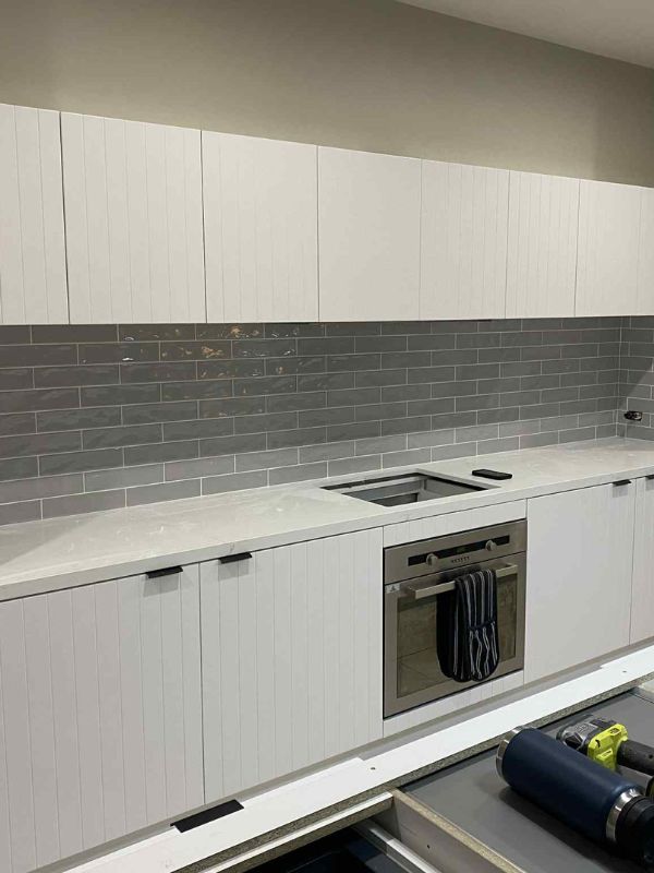 kitchen resurfaced with new cabinet doors in white