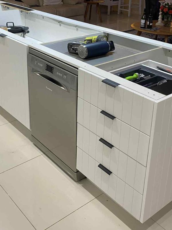 kitchen island cupboards resurfaced with white paint and door profiling