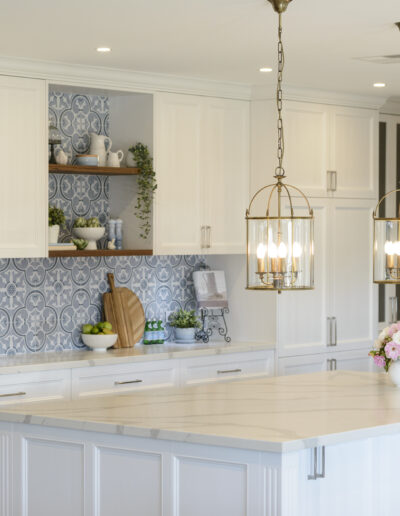 Kitchen island cabinetry finished with hand applied antique paint