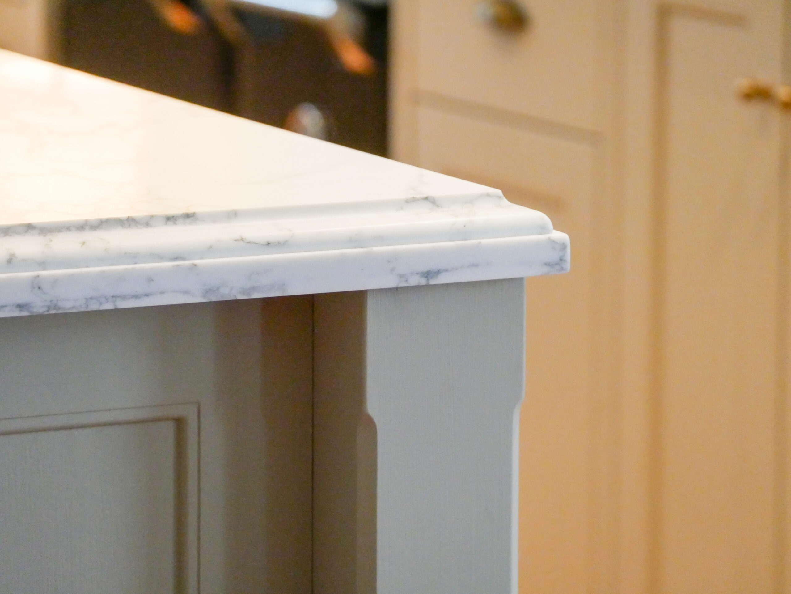 Kitchen island featuring lambs tongue edge and hand painted finish
