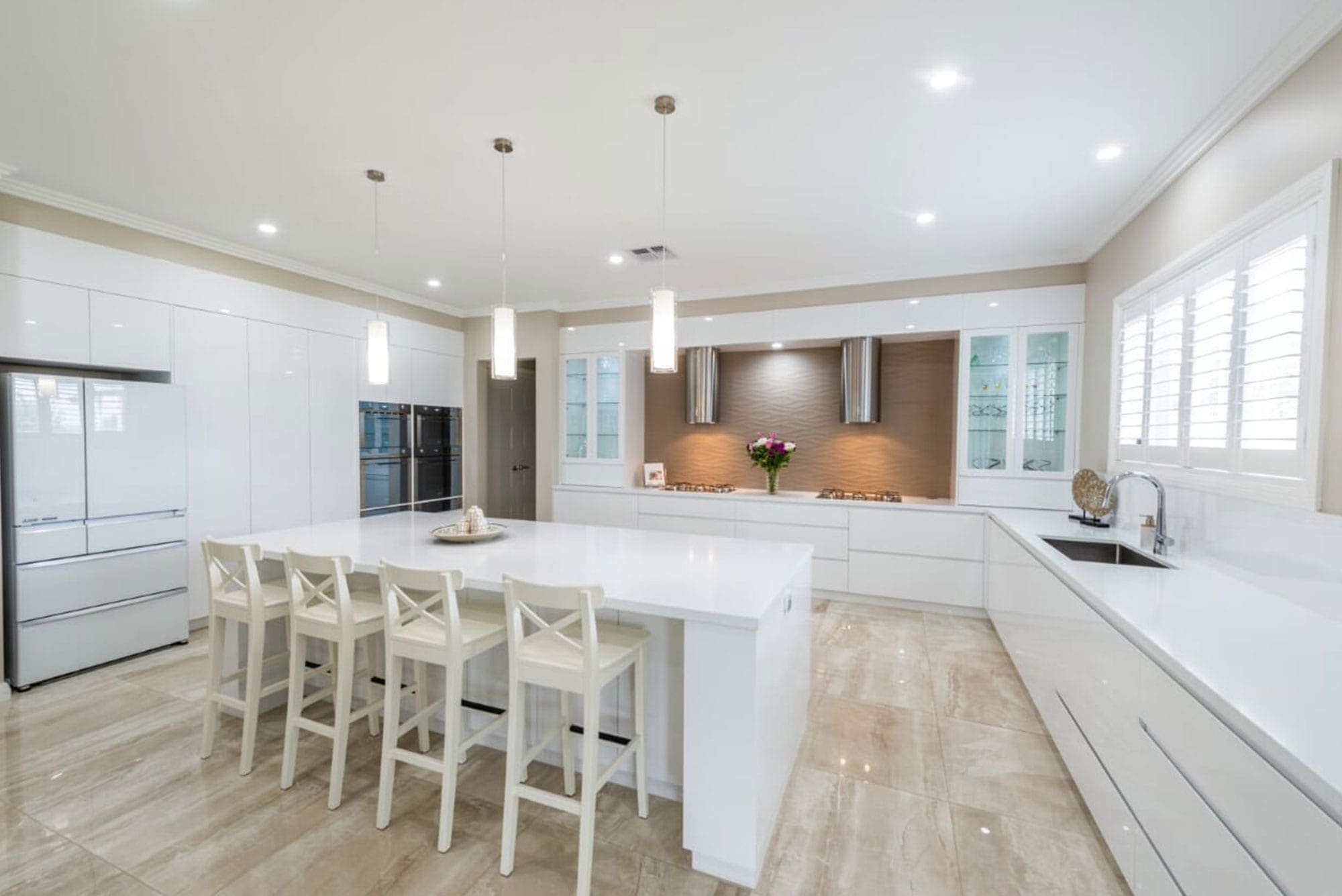 High gloss 2Pac kitchen cabinets reflecting natural light with premium polyurethane finish